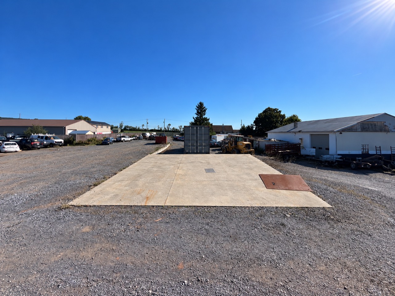The paved loading area and garage at Eashs